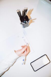 Woman writing a plan on paper